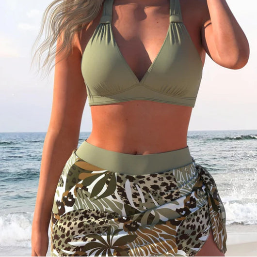 Women's olive green halter push-up bikini top with a matching tropical and leopard print sarong skirt on a beach. - Image 2