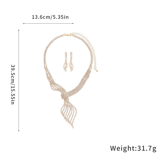 Gold-tone rhinestone necklace and matching dangle earrings set. The necklace features a multi-strand, leaf-like design. - Image 11