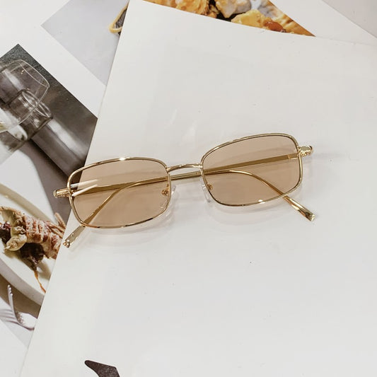 Retro gold metal frame sunglasses with light brown rectangular lenses, displayed on a white surface. - Image 2