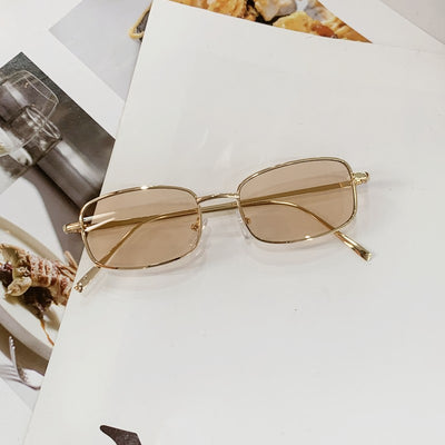 Retro gold metal frame sunglasses with light brown rectangular lenses, displayed on a white surface. - Image 2