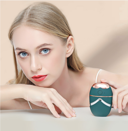 White and rose gold eye protector mini spray and conditioner atomizing device with a smooth, ergonomic design.
