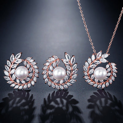 Elegant pearl and cubic zirconia jewelry set with a necklace and two earrings, featuring a wreath design. - Image 2