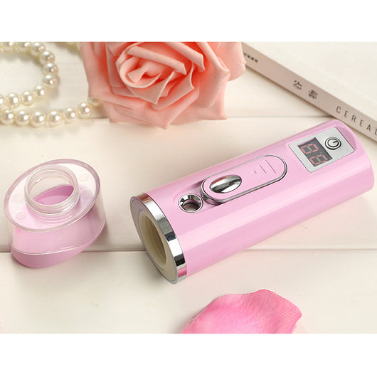 White and rose gold nano spray water meter with a clear tank, digital display, and power button. - Image 13