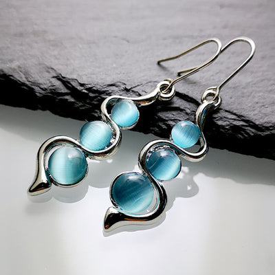 Aretes Ondulados Estilo Bohemio con Gema Ojo de Gato - Image 4