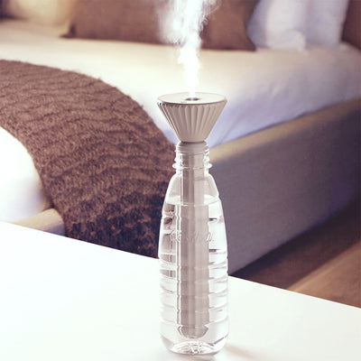 Beige and white USB ultrasonic humidifier with a fluted conical top and a cylindrical body with a water level window. - Image 6