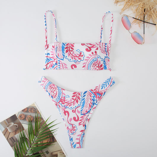 White ribbed two-piece swimsuit with pink and blue paisley floral print, bandeau top, and high-cut bottoms. - Image 3