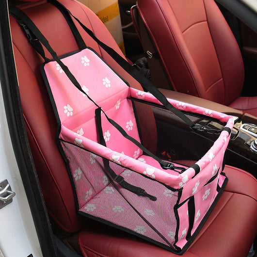 Light grey pet car booster seat with black mesh sides and adjustable straps, installed on a black and red car seat. - Image 17