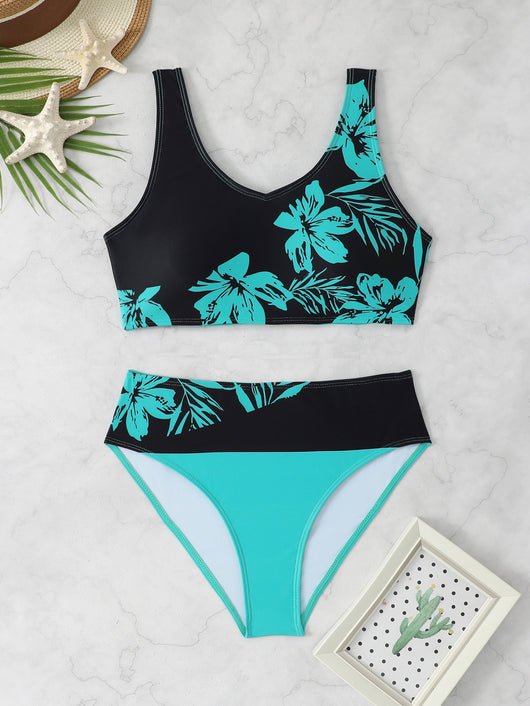 Women's two-piece swimsuit with black and purple floral print. Features a V-neck sports bra top and mid-rise bottom. - Image 8