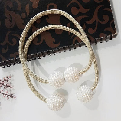 Magenta elastic curtain tieback with two white pearl-beaded spheres, designed to hold curtains elegantly. - Image 3