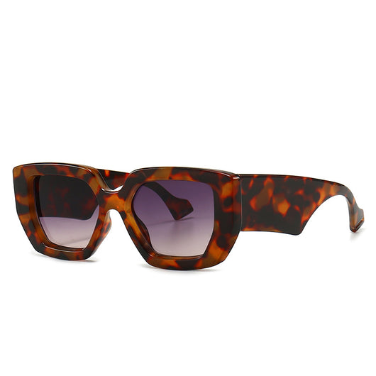 Modern retro sunglasses with a thick light brown plastic frame and dark lenses, featuring wide black temples.