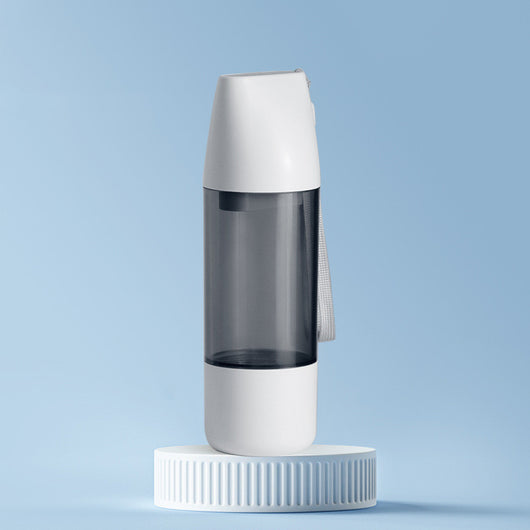 White and translucent gray portable pet water bottle with integrated food container and carrying strap. - Image 6