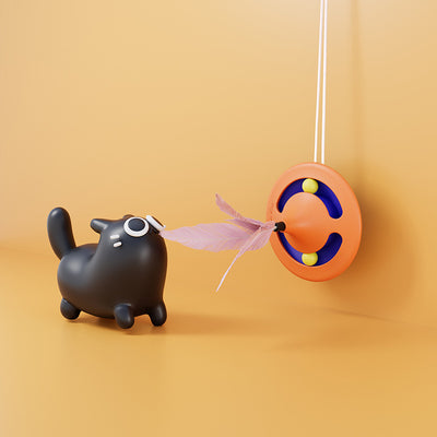 Orange and blue cat turntable toy with purple feathers, hanging from a clear suction cup on a white background. - Image 2