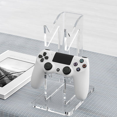 Black AOLION universal gamepad stand made of ABS plastic, designed to hold a game controller upright. - Image 13