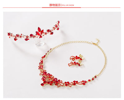 Red rhinestone bridal jewelry set featuring a floral necklace and matching dangle earrings on a model. - Image 7