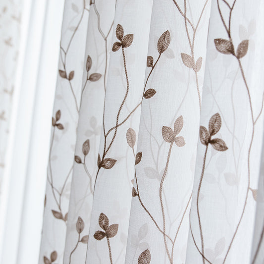 Sheer white curtains with a delicate brown leafy vine pattern, offering light transmission for a pastoral style room.