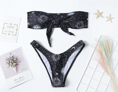 Black celestial print bikini set with a bandeau tie-front top and high-cut bottoms, featuring sun, moon, and star patterns. - Image 7