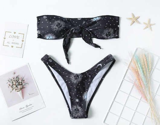 Black celestial print bikini set with a bandeau tie-front top and high-cut bottoms, featuring sun, moon, and star patterns. - Image 7