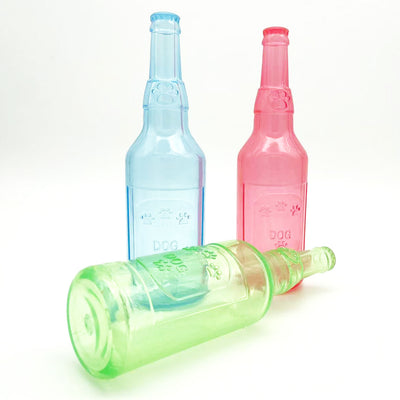 Translucent blue pet molar toy shaped like a bottle, featuring embossed paw prints and the word "DOG". - Image 3