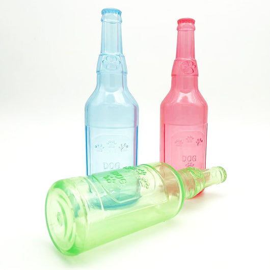 Translucent blue pet molar toy shaped like a bottle, featuring embossed paw prints and the word "DOG". - Image 3