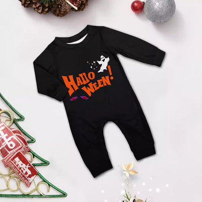 Family of four wearing matching black and orange Halloween long-sleeve pajamas with ghost and bat prints. - Image 5