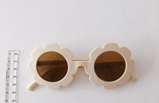 Orange flower-shaped sunglasses for babies and toddlers with dark lenses and a plastic frame. - Image 10