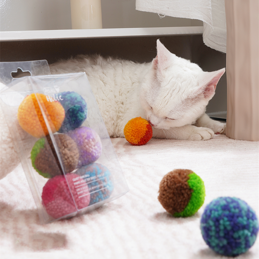 Two fluffy cat pom-pom toys, one pink and blue, one pink, in a clear box with a small bottle of catnip hydrosol. - Image 19