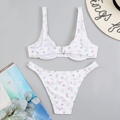 Light blue floral bikini with pink and yellow flowers, featuring an underwire top and high-cut bottom. - Image 17