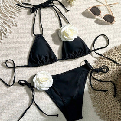 Black two-piece bikini with white 3D flower embellishments on the triangle top and tie-side bottom. - Image 9