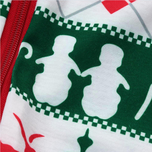 Family of four wearing matching red, green, and white Fair Isle Christmas pajamas, smiling together. - Image 8