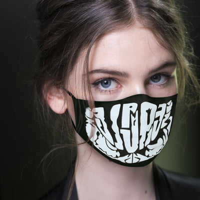 Young woman wearing a black ear hook facial mask with a white skull design, perfect for Halloween. - Image 3