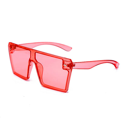 Oversized flat-top sunglasses with translucent red plastic frames and matching red lenses on a white background. - Image 17