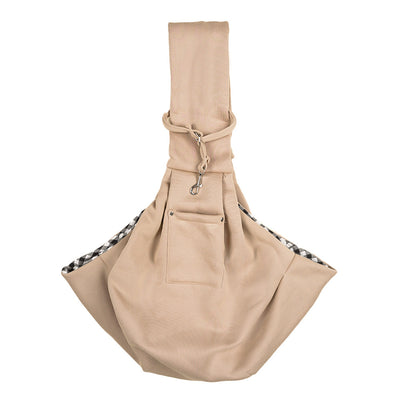 Person in white hoodie carrying a happy white dog in a navy blue pet sling bag outdoors. - Image 21