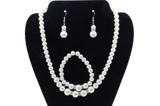 Off-white pearl necklace, matching drop earrings, and bracelet set with rhinestone accents for bridal wear. - Image 5