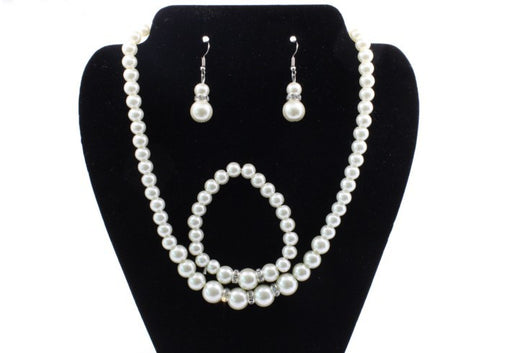 Off-white pearl necklace, matching drop earrings, and bracelet set with rhinestone accents for bridal wear. - Image 4
