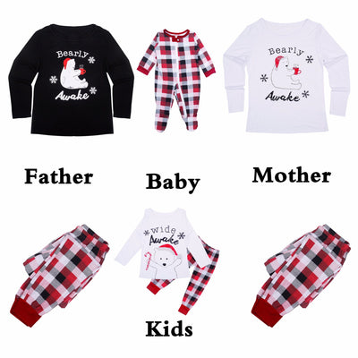 Mother and child in matching red, black, and white plaid Christmas pajamas, child wearing a Santa hat. - Image 3