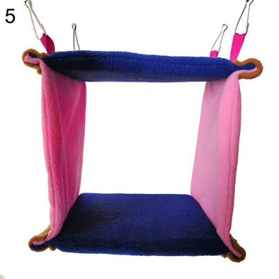 Colorful blue and pink fleece bird hammock nest with a small bird peeking out, hanging by metal clips. - Image 12