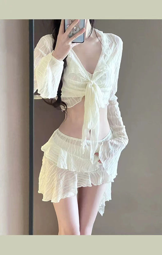 White four-piece bikini swimsuit set for women, featuring a long-sleeve tie-front top and tiered ruffle skirt. - Image 13