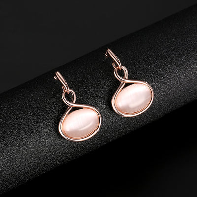 Rose gold necklace and matching drop earrings set with oval light pink cabochon stones. - Image 4