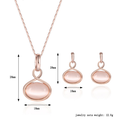 Rose gold necklace and matching drop earrings set with oval light pink cabochon stones. - Image 3
