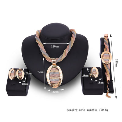 Four-piece jewelry set with tri-color braided necklace, earrings, bracelet, and ring. Each piece features an oval design with a Greek key border and striped gol - Image 3