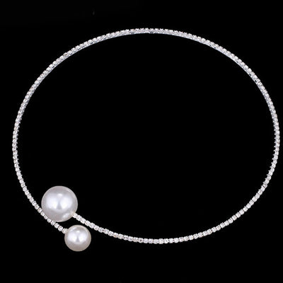 Elegant silver-tone choker necklace with a single row of clear rhinestones and two white faux pearls of varying sizes. - Image 5