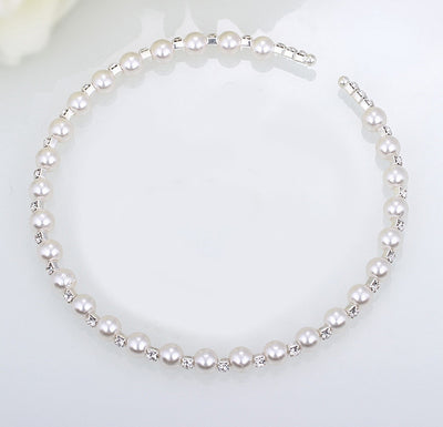 Bridal three-piece jewelry set with white pearls and clear rhinestones, including a necklace, bracelet, and square stud earrings. - Image 6