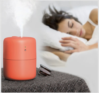 Coral desktop humidifier with a modern cylindrical design, featuring a green indicator light and a power button. - Image 14