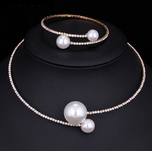 Elegant silver-tone choker necklace with a single row of clear rhinestones and two white faux pearls of varying sizes. - Image 3
