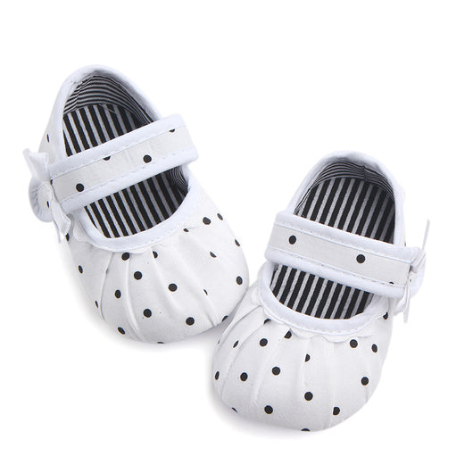 Black baby girl Mary Jane shoes with white polka dots, a strap, bow accent, and striped lining. - Image 23
