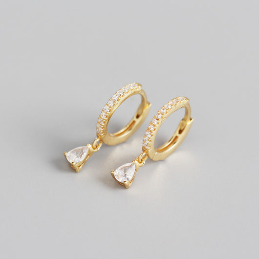 Silver-colored hoop earrings with black pave stones and dangling black teardrop-shaped stones. - Image 9