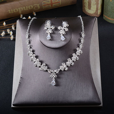 Silver-tone rhinestone necklace and pierced drop earrings set with floral and teardrop designs, ideal for bridal wear. - Image 3