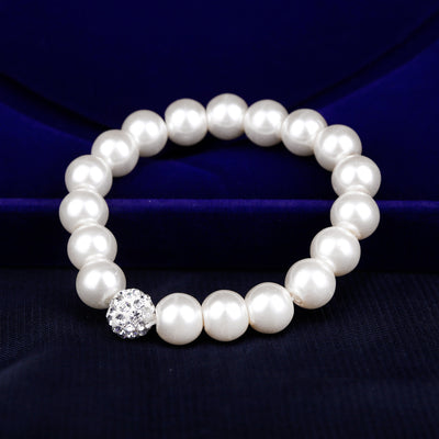 White faux pearl necklace, bracelet, and dangle earrings set with pave crystal beads on a black display. - Image 4
