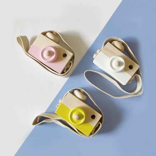 Two-tone wooden toy camera in natural wood and light blue with a cream fabric strap, for babies and kids. - Image 2