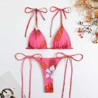 Vibrant floral print bikini set with tie-side triangle top and matching bottoms, featuring pink, blue, orange, and purple flowers. - Image 4